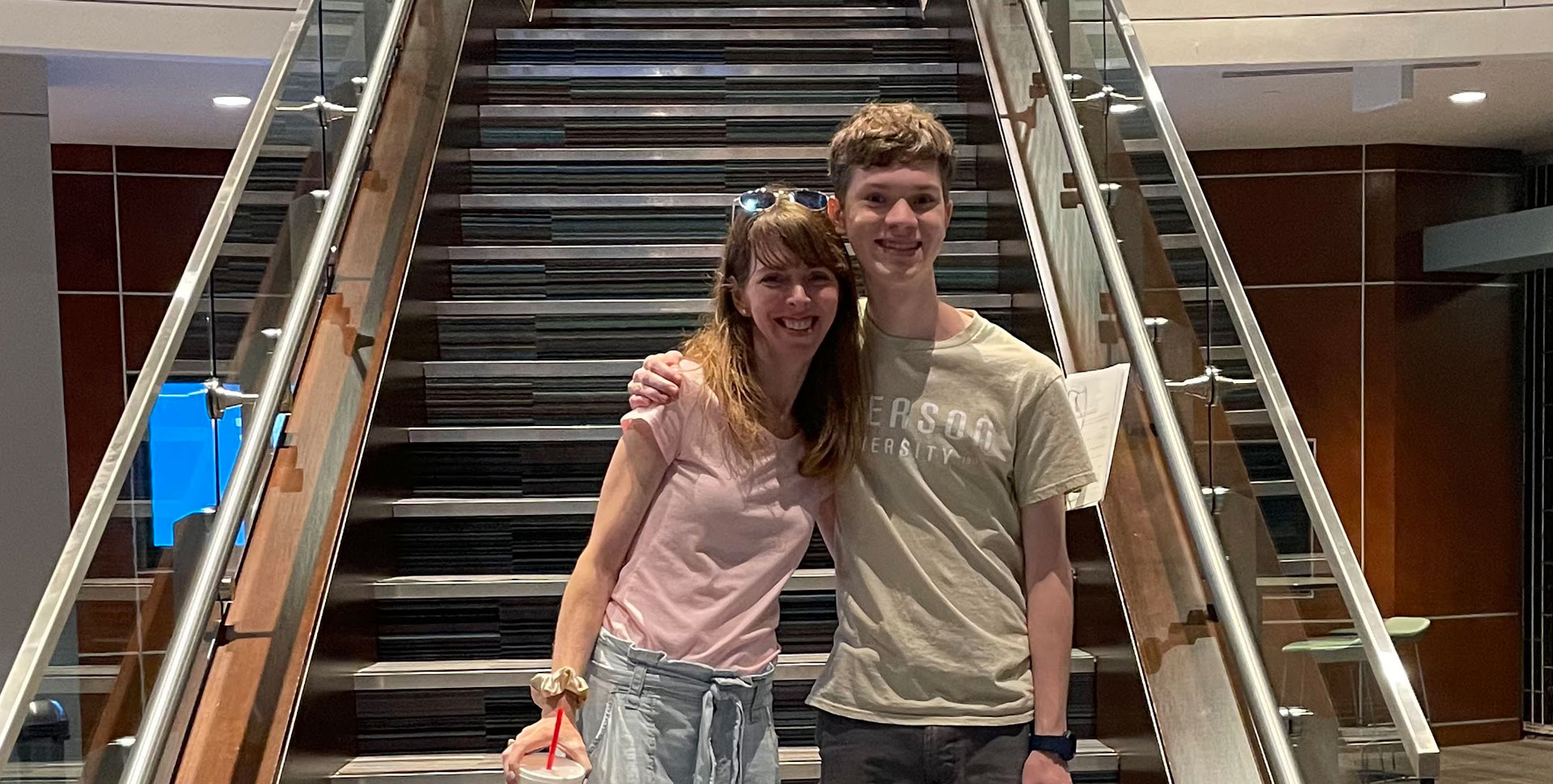 Mom and son at the bottom of student center stairs
